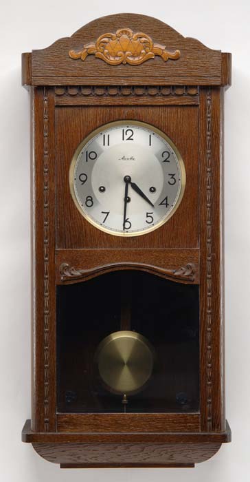 Appraisal: ENGLISH OAK BOX CLOCK The silver colored round dial marked