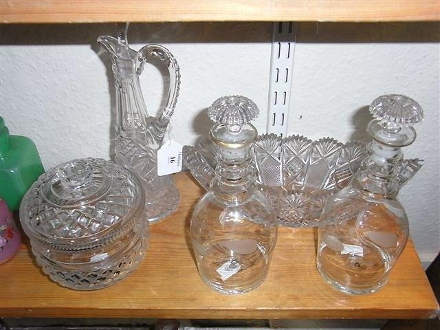 Appraisal: A PAIR OF VICTORIAN GLASS DECANTERS with etched and gilt