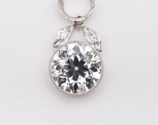 Appraisal: Platinum and Diamond Pendant PLATINUM AND DIAMOND PENDANTbezel-set with an