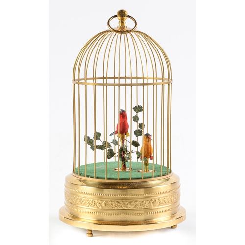 Appraisal: A Swiss clockwork singing bird in a cage automaton late