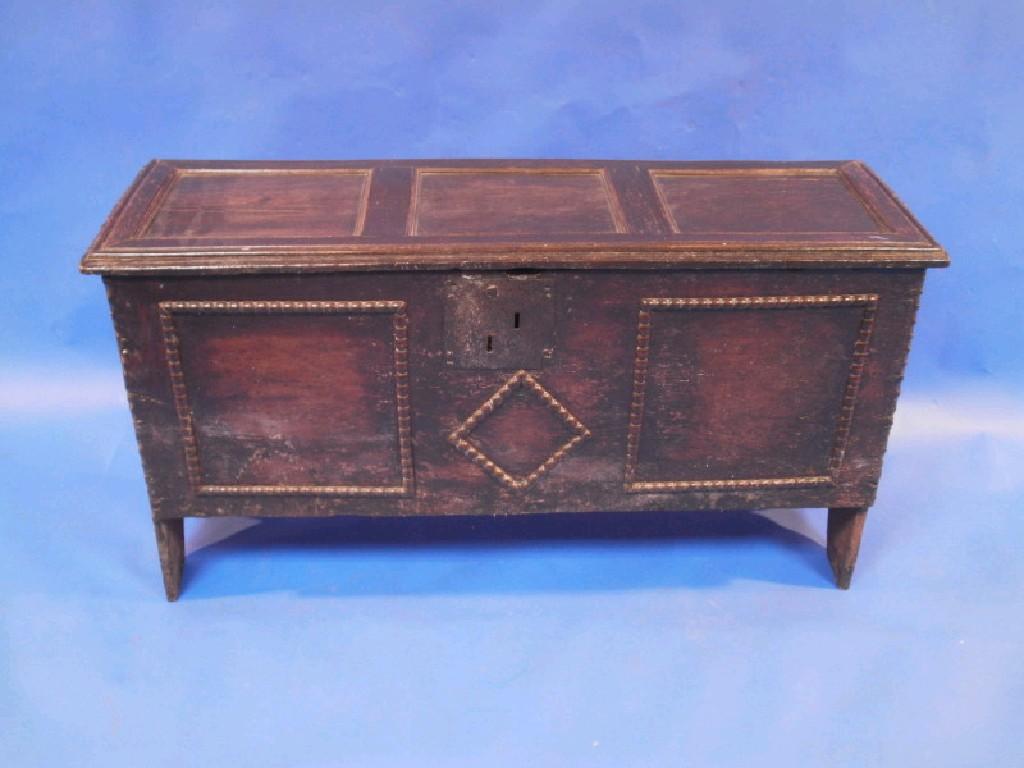 Appraisal: A early thC oak boarded chest with later applied mouldings