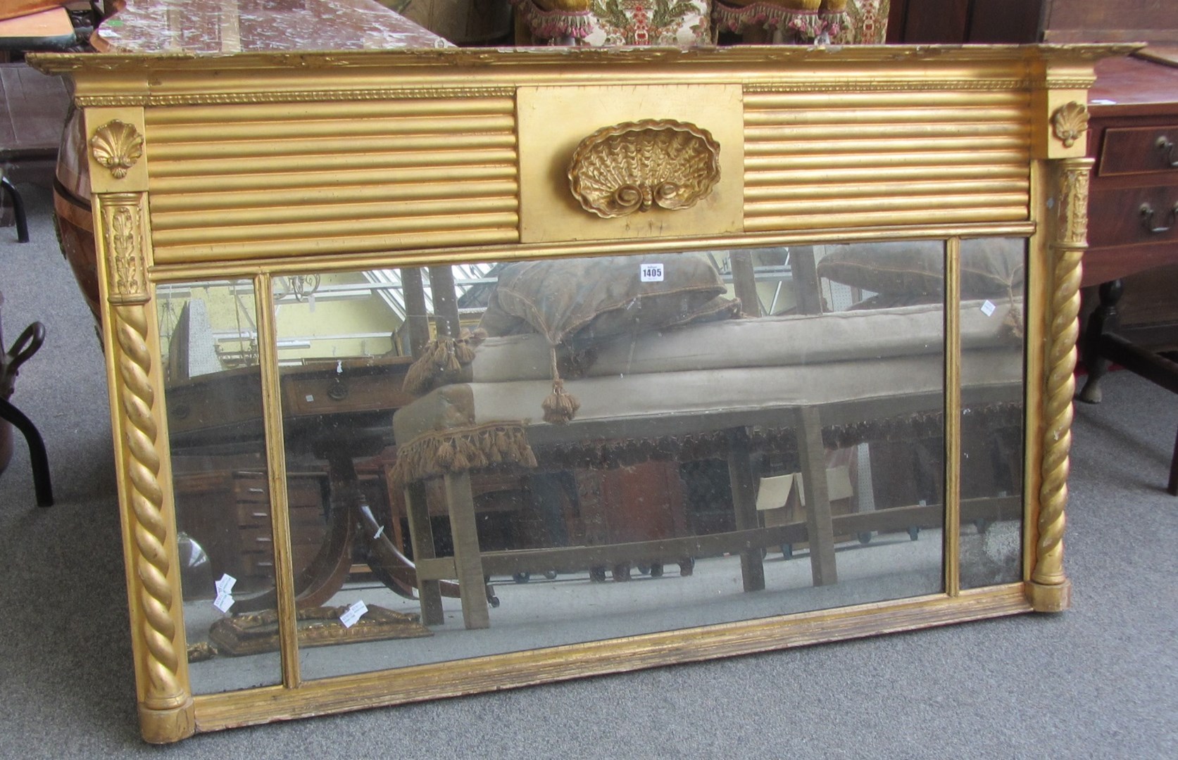 Appraisal: An early th century gilt framed triple plate overmantel mirror