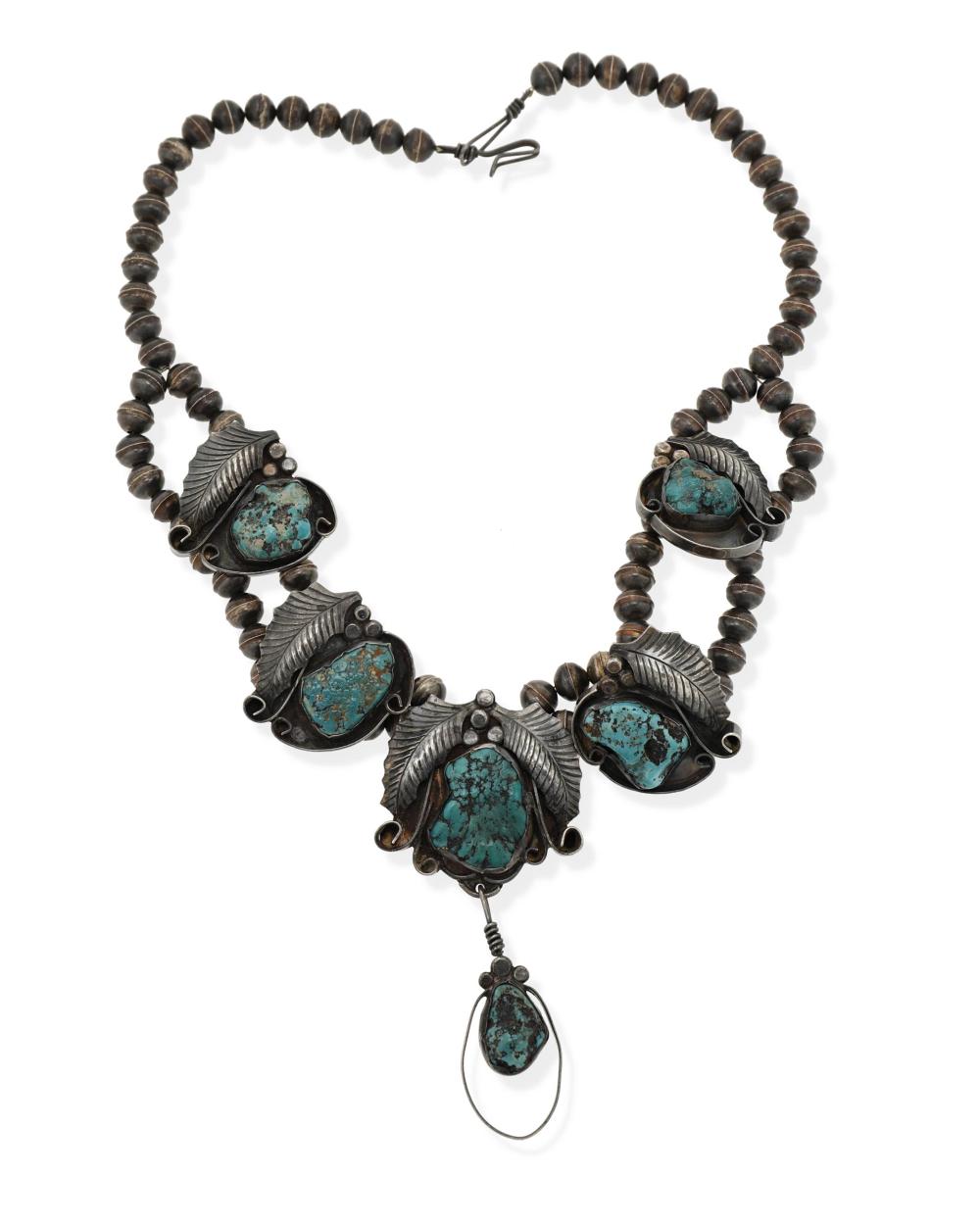 Appraisal: A Jimmie Nezzie Navajo turquoise and silver pendant necklace Fourth-Quarter