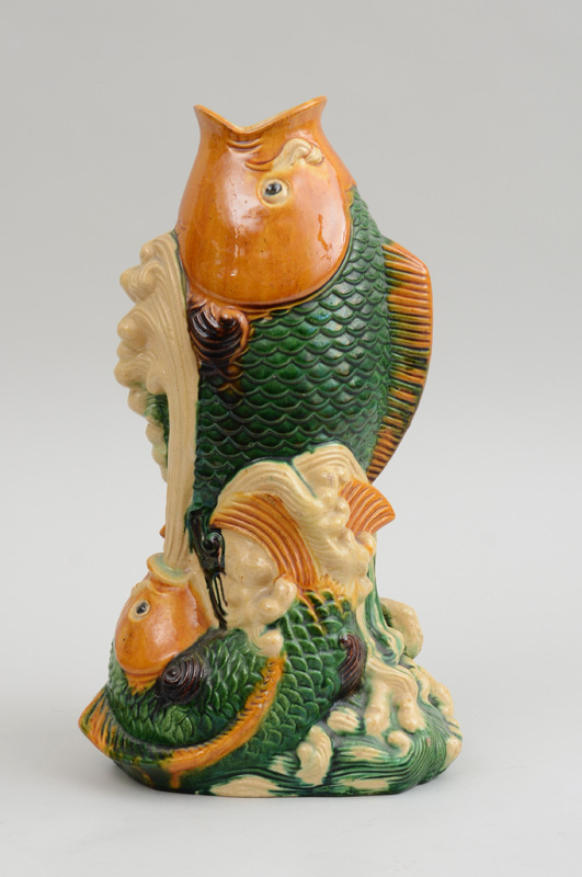 Appraisal: CHINESE SANCAI-GLAZED POTTERY CARP-FORM VASE Unmarked modeled as two carp