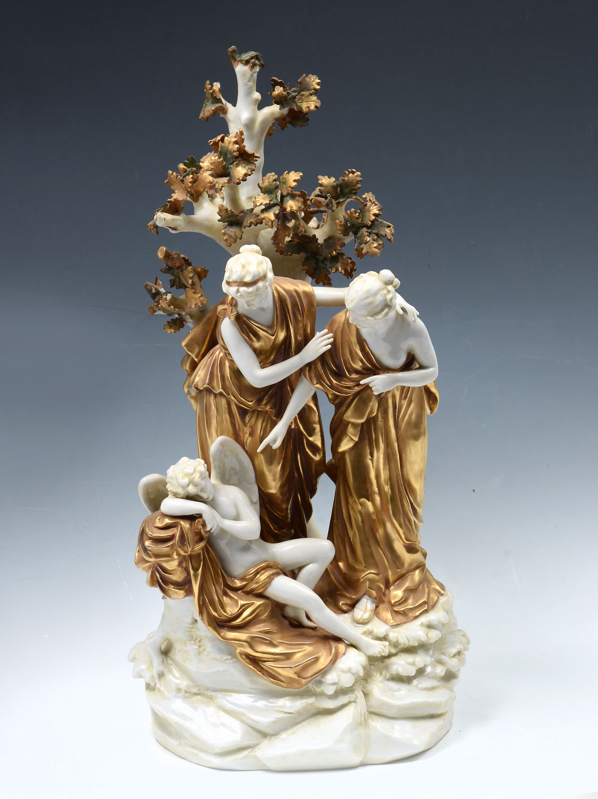 Appraisal: VOLKSTEDT PORCELAIN FIGURAL GROUPING female figures looking over a fallen