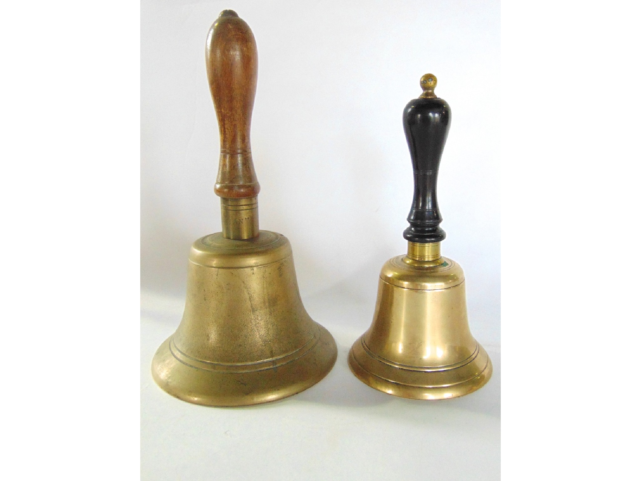 Appraisal: A large antique school bell with turned timber handle with