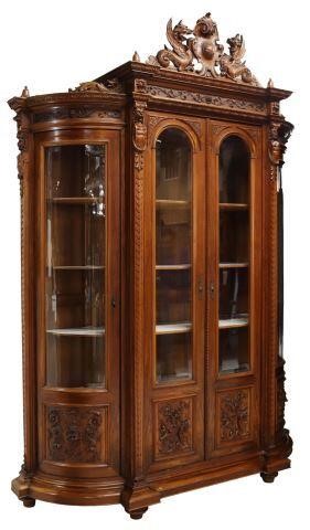 Appraisal: Monumental Renaissance Revival walnut bookcase display cabinet late th c