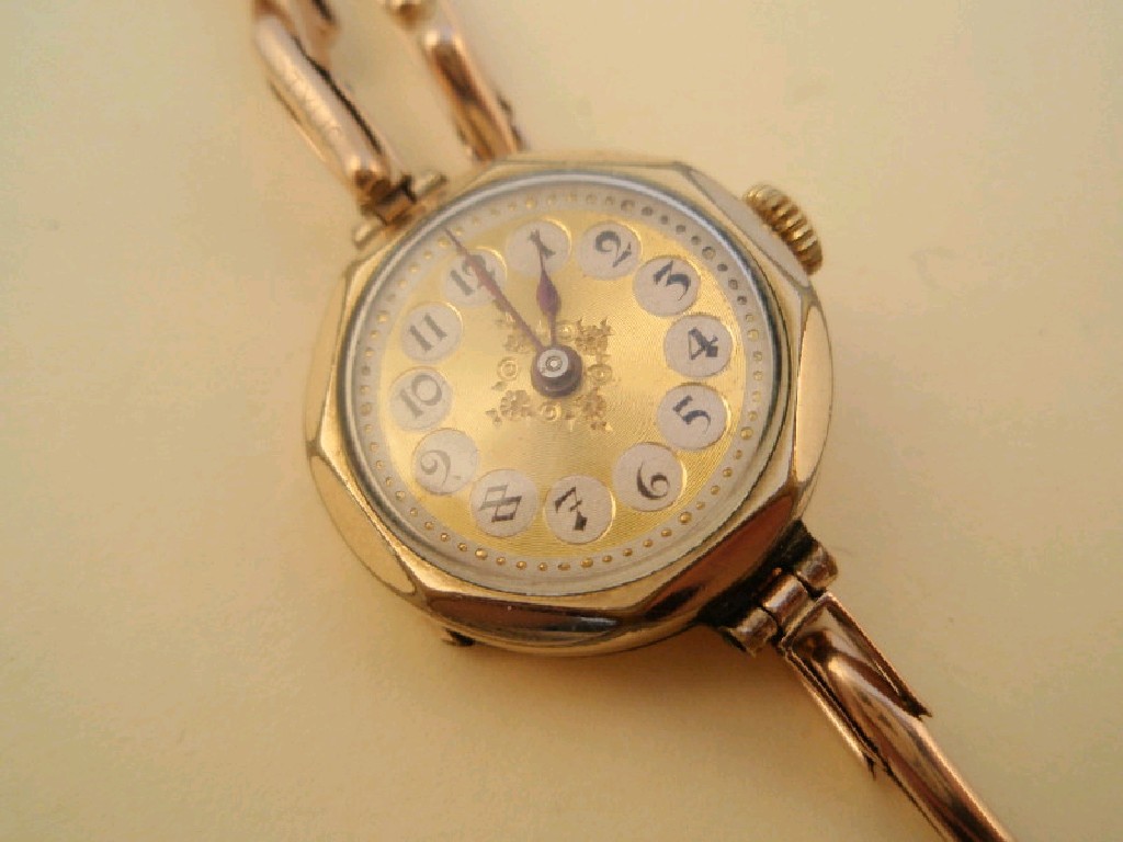 Appraisal: A ladies 's style gold cased wristwatch on expanding bracelet