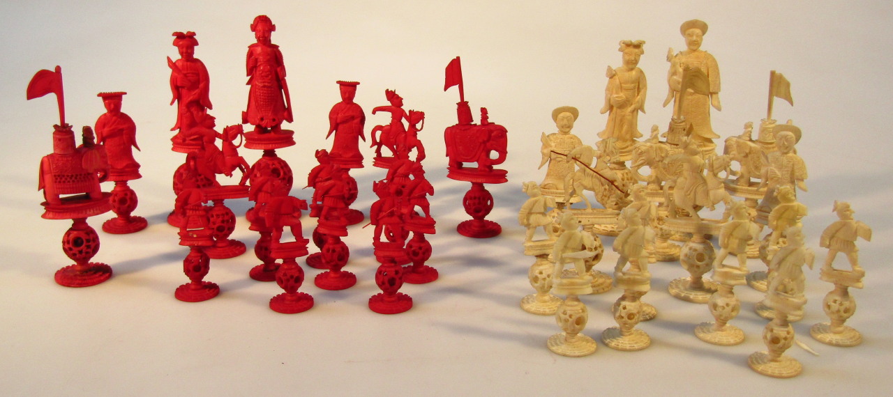 Appraisal: A Chinese Qing period carved ivory chess set with red