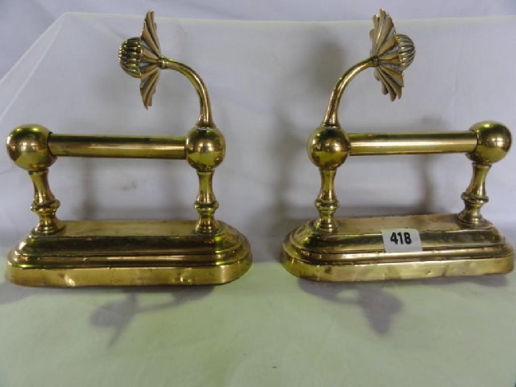 Appraisal: A pair of Victorian brass fire dogs in an aesthetic