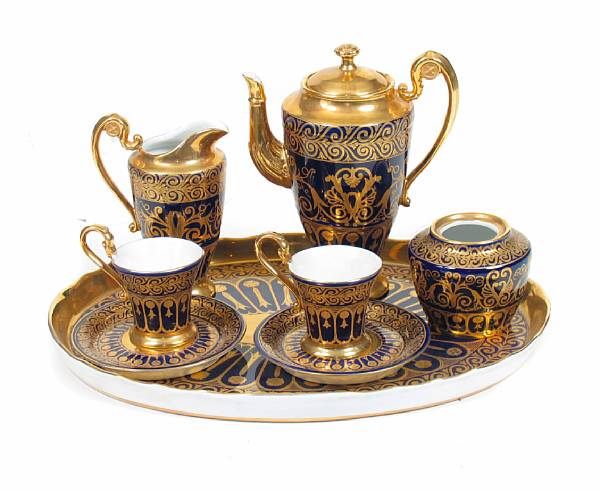 Appraisal: A six piece Sevres style cobalt and gilt decorated coffee