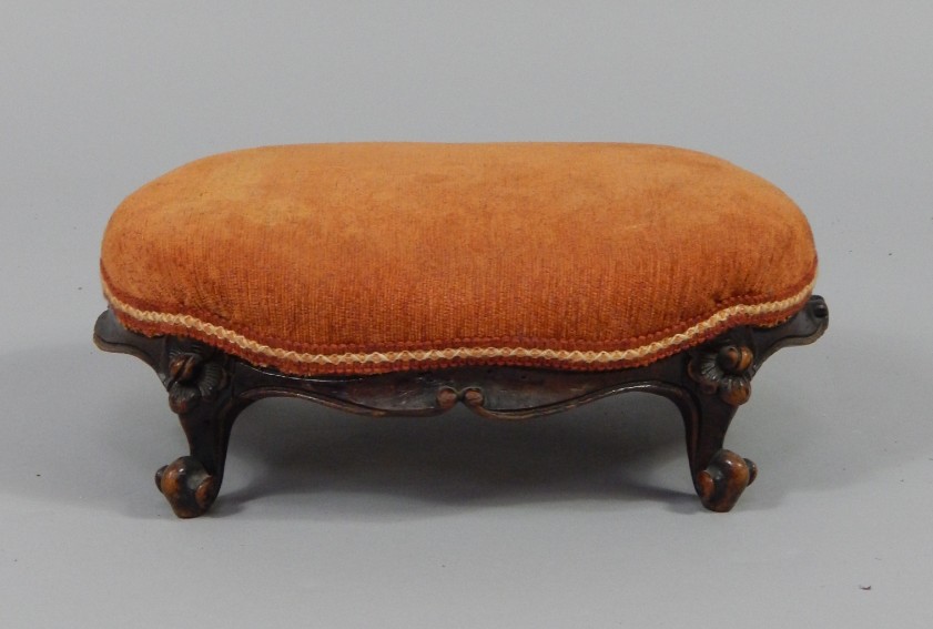 Appraisal: A Victorian oval mahogany foot stool with over stuffed upholstered