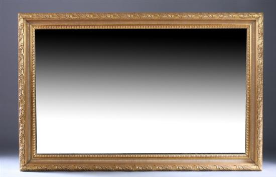 Appraisal: NEOCLASSICAL STYLE GILT-WOOD OVER-SCALE MIRROR late th century with bevelled-edge