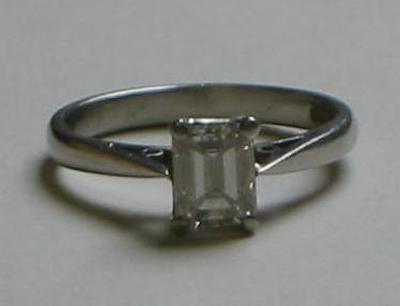 Appraisal: A SOLITAIRE DIAMOND RING the emerald cut stone approximately cts