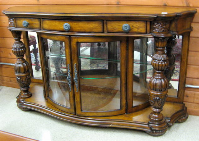 Appraisal: CARVED HARDWOOD AND CURVED GLASS CHINA BUFFET Pulaski Furniture Co