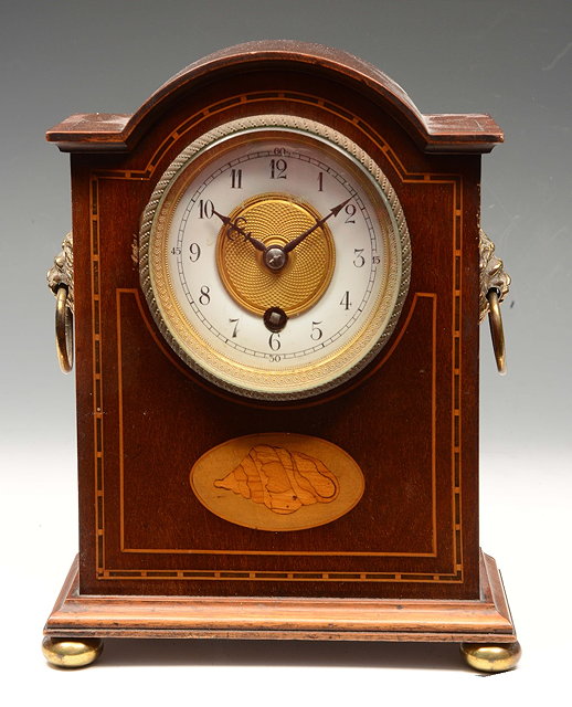 Appraisal: AN EDWARDIAN MAHOGANY AND BOX STRUNG MANTEL TIMEPIECE with arched