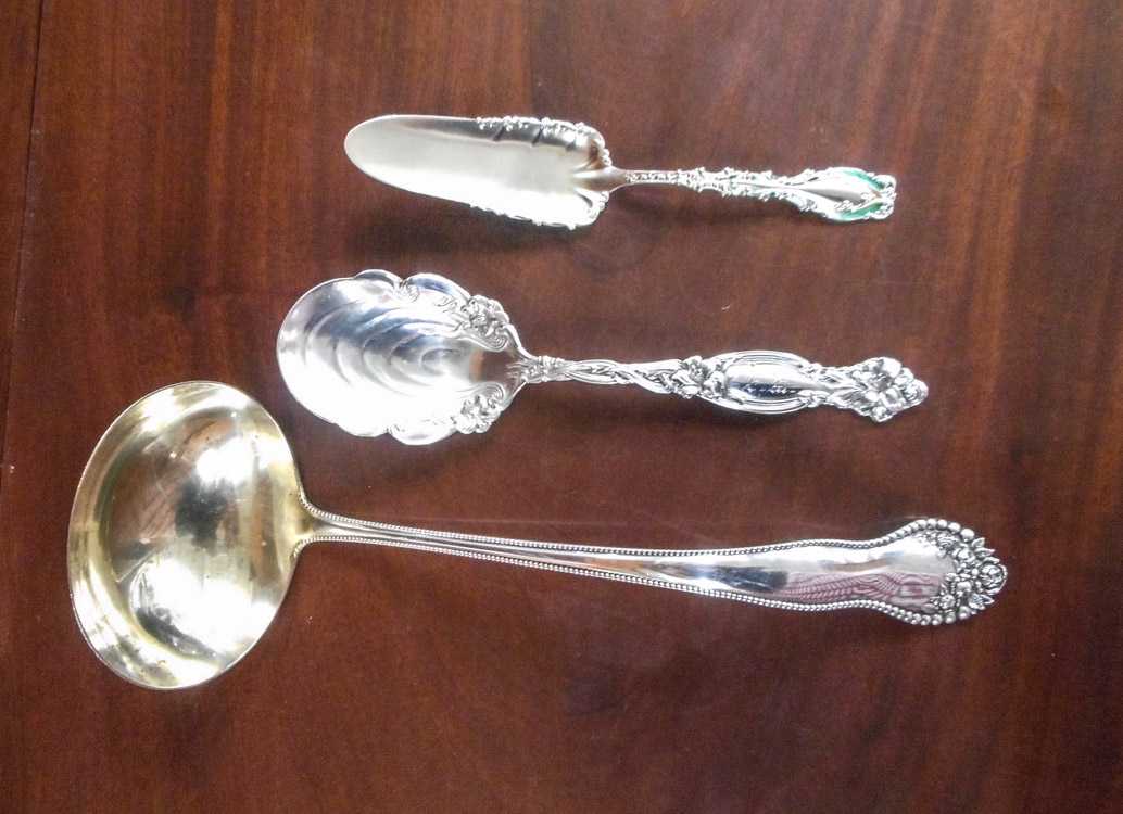 Appraisal: THREE STERLING SILVER SERVING PIECES various maker's and patterns punch