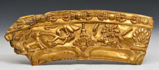 Appraisal: A TIBETAN GILT METAL FRIEZE with buddha dog and bird