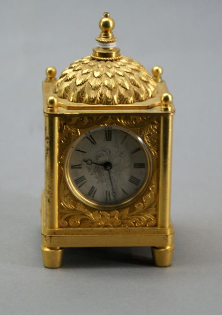 Appraisal: A French Louis XVI style carriage clock in gilded metal