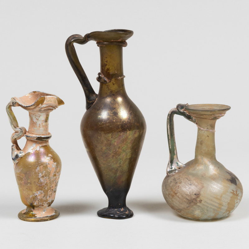 Appraisal: Group of Three Roman Glass Jugs with Handles The tallest