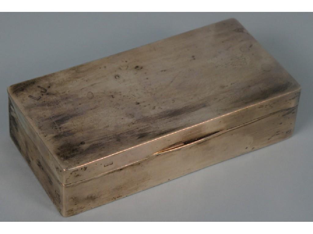 Appraisal: A silver rectangular sandwich box the lid engraved with the