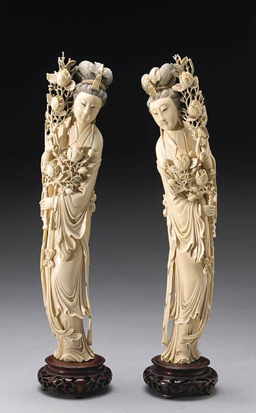 Appraisal: A pair of large carved ivory maidens th Century The