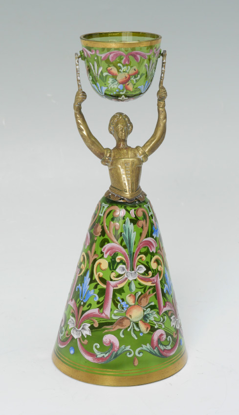 Appraisal: ENAMELED GREEN GLASS WEDDING CUP Figural brass maiden with green