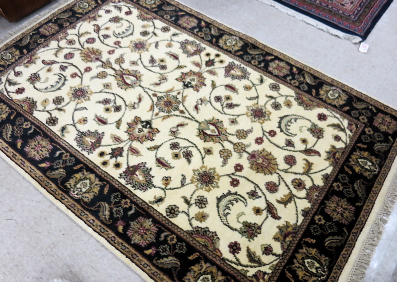 Appraisal: HAND KNOTTED ORIENTAL AREA RUG Indo-Persian overall floral design on