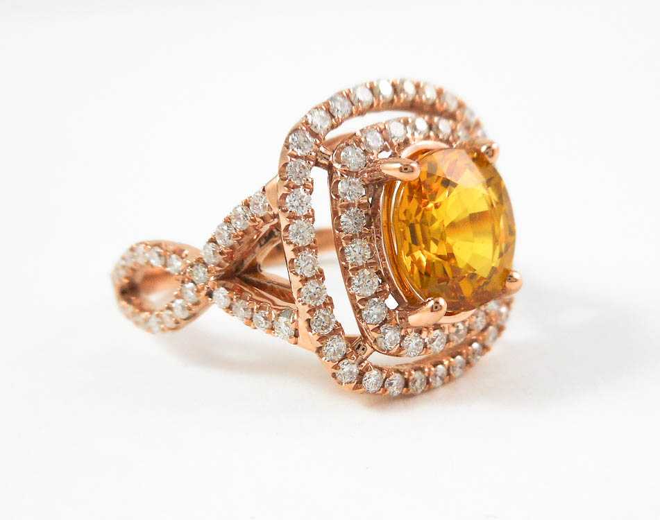 Appraisal: YELLOW SAPPHIRE AND FOURTEEN KARAT ROSE GOLD RING with round-cut