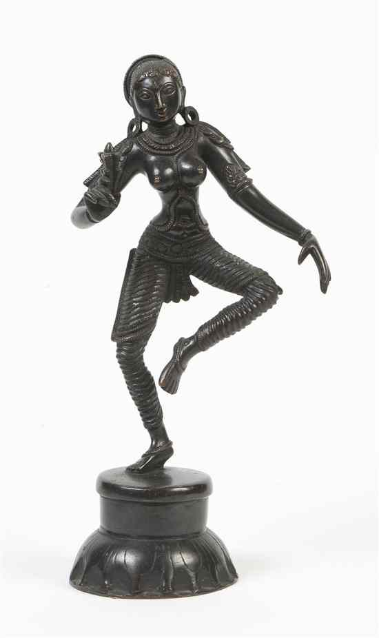 Appraisal: An Indian Bronze Figure of a Deity depicted dancing with