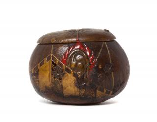 Appraisal: A Wood Lidded Box of rounded form with a carved