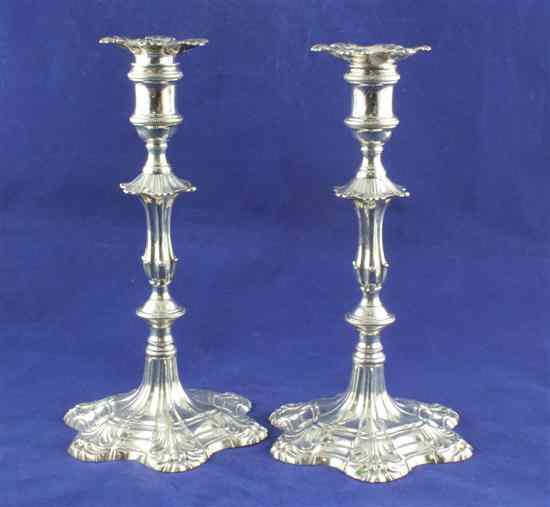 Appraisal: A pair of late George II cast silver candlesticks with