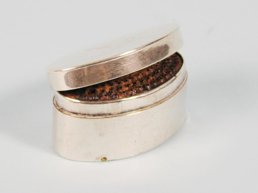 Appraisal: A George III plain oval Nutmeg Grater with hinged cover