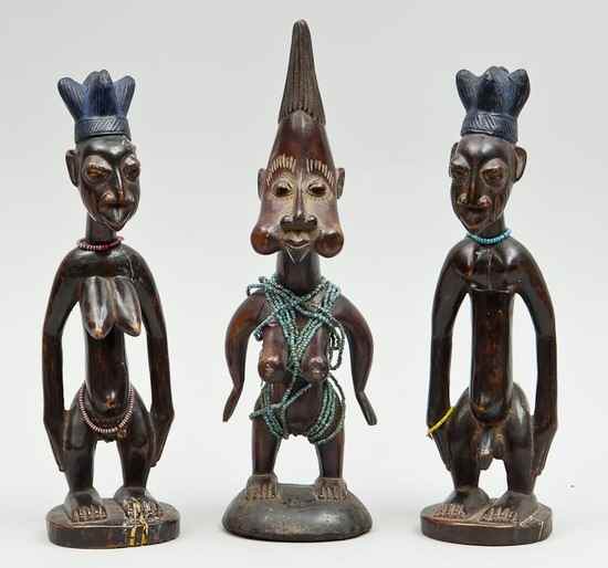 Appraisal: A group of three Yoruba Ibejis Nigeria late th century