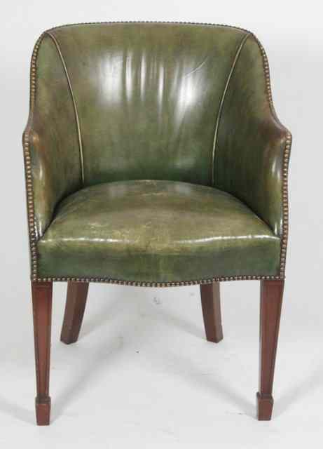 Appraisal: A George III style tub chair upholstered in close studded