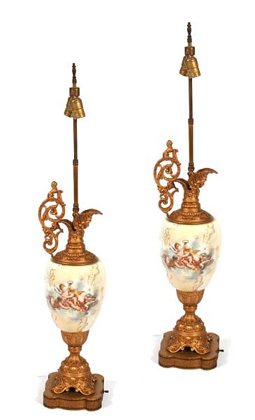 Appraisal: A pair of gilt metal and porcelain table lamps height