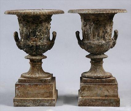 Appraisal: PAIR OF ENGLISH CAST IRON URNS AFTER THE BORGHESE VASE