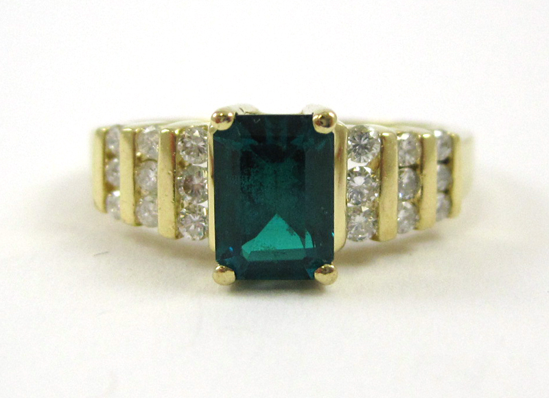 Appraisal: EMERALD DIAMOND AND FOURTEEN KARAT GOLD RING with three rows