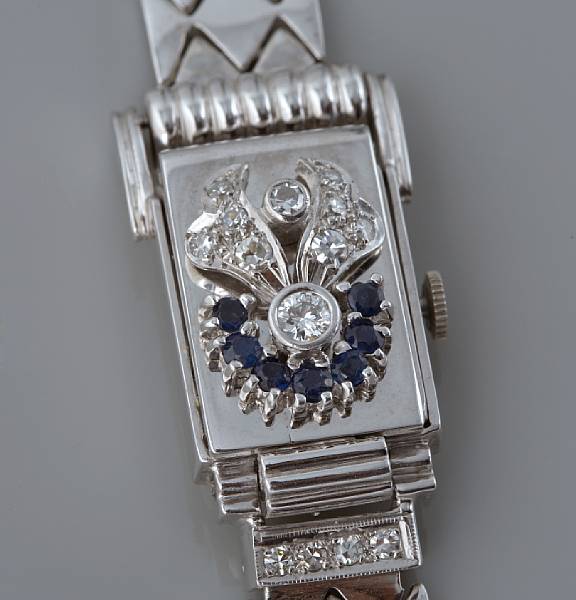 Appraisal: A diamond and sapphire covered dial bracelet watch jewel Swiss