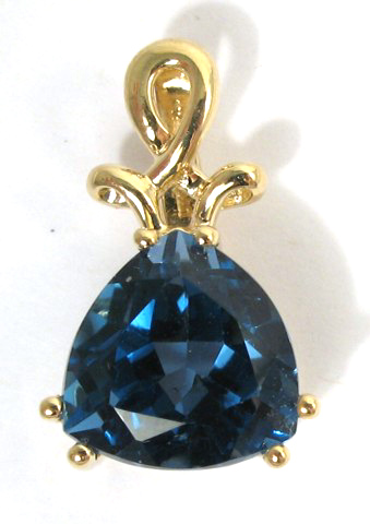 Appraisal: BLUE TOPAZ AND EIGHTEEN KARAT GOLD PENDANT set with a