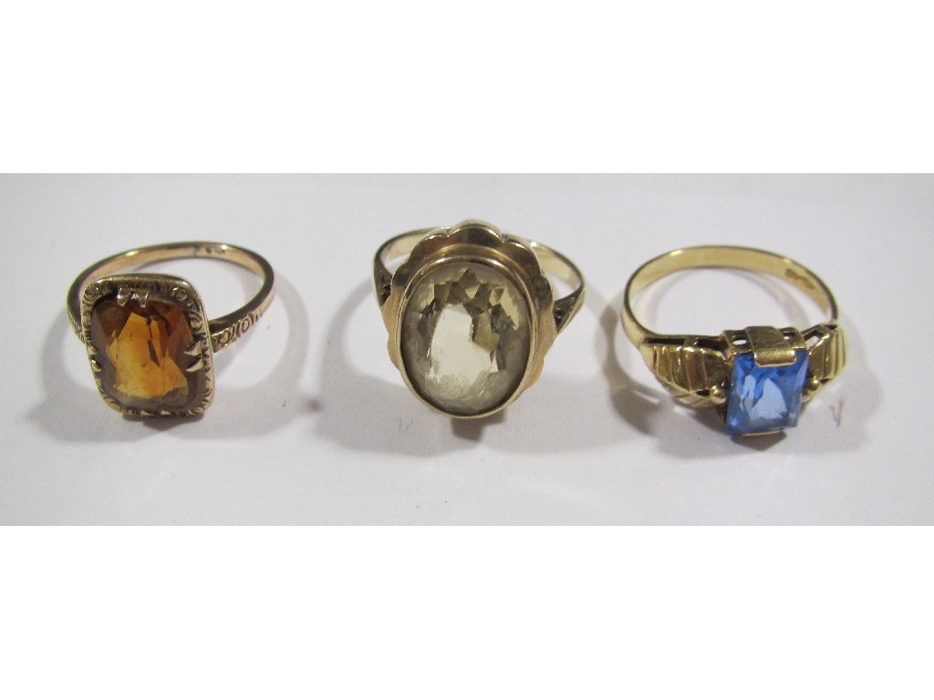 Appraisal: Lot comprising two ct gold topaz single stone rings and