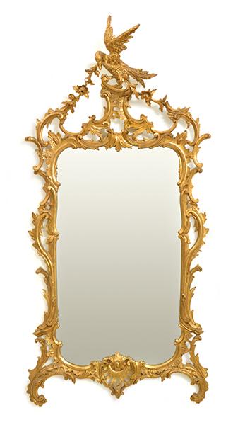 Appraisal: A CHIPPENDALE STYLE GILT WOOD FRAMED WALL MIRROR the shaped