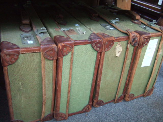 Appraisal: Five canvas and leather bound suitcases early th century a