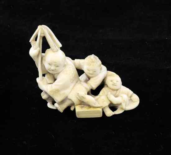 Appraisal: A Japanese small ivory group Meiji period modelled as a