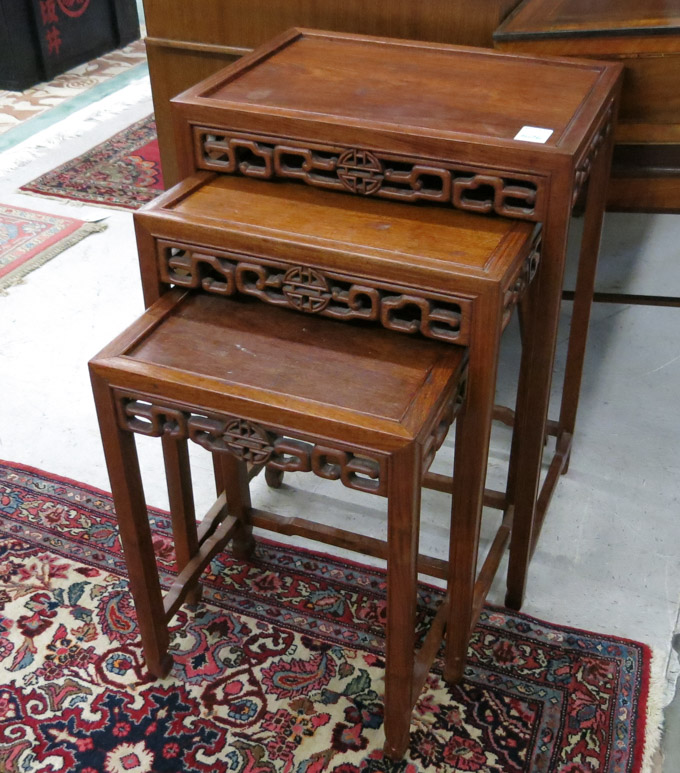 Appraisal: CHINESE NESTING TABLE SET composed of three rectangular teakwood tables