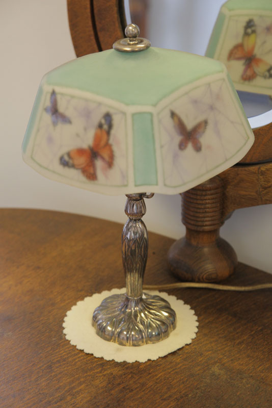 Appraisal: PAIRPOINT BOUDOIR LAMP Silver base with embossed foliate motif and