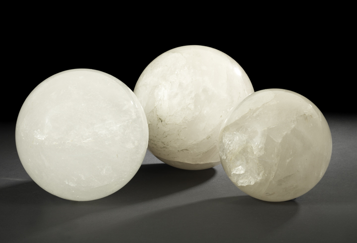 Appraisal: Set of Three Graduated Rock Crystal Spheres each richly grained