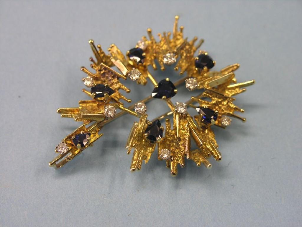 Appraisal: A Garrard Co ct gold diamond and sapphire brooch bark-effect