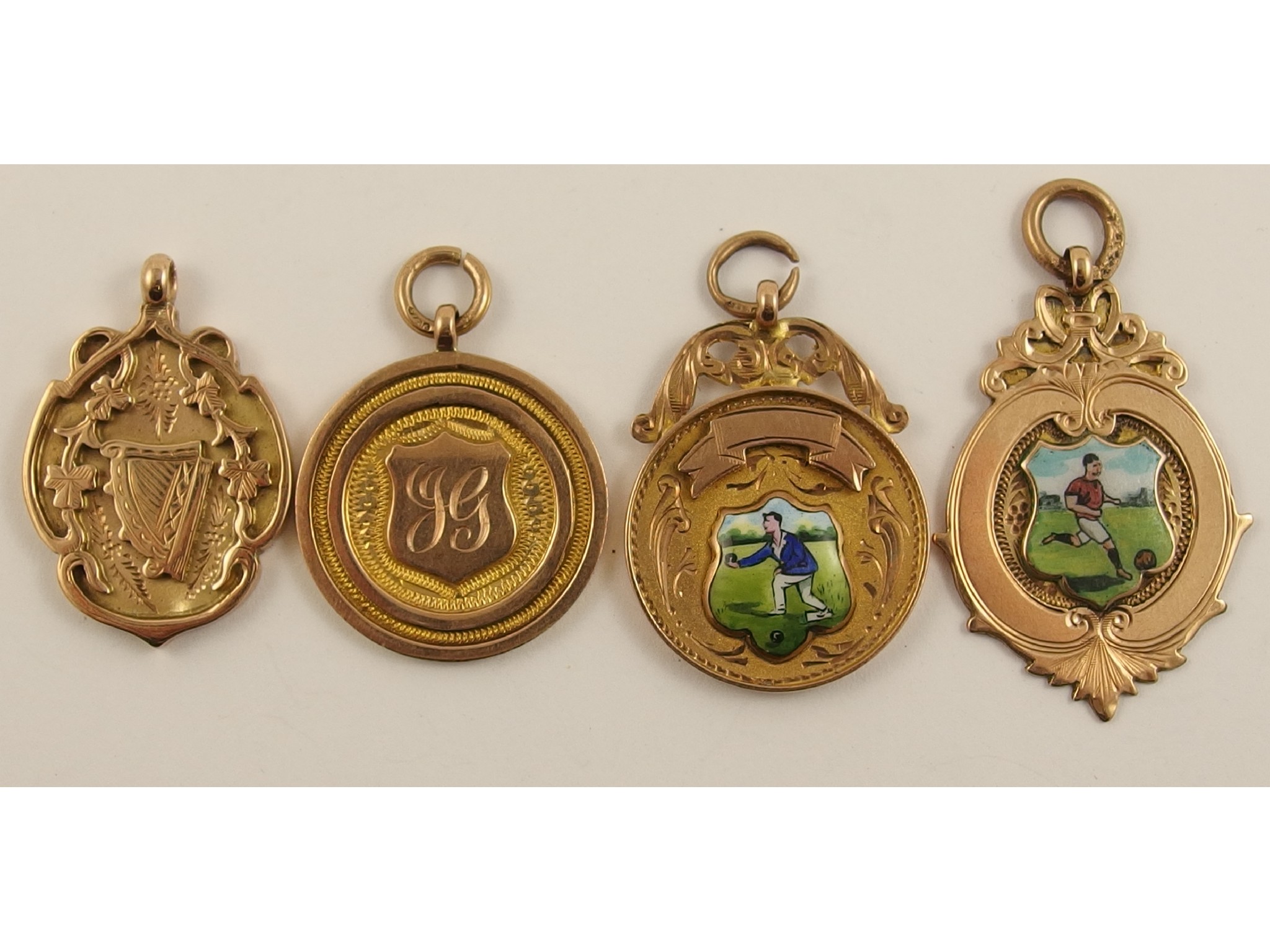 Appraisal: Two ct enamelled medallions a ct Irish themed medallion and