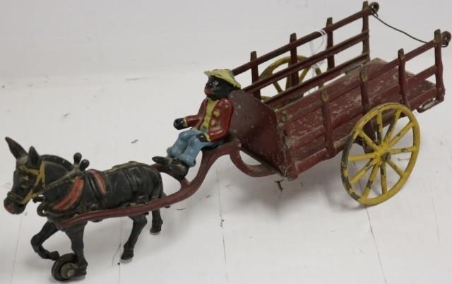 Appraisal: CA CAST IRON AND TIN MULE DRAWN WAGON WITHAFRICAN AMERICAN